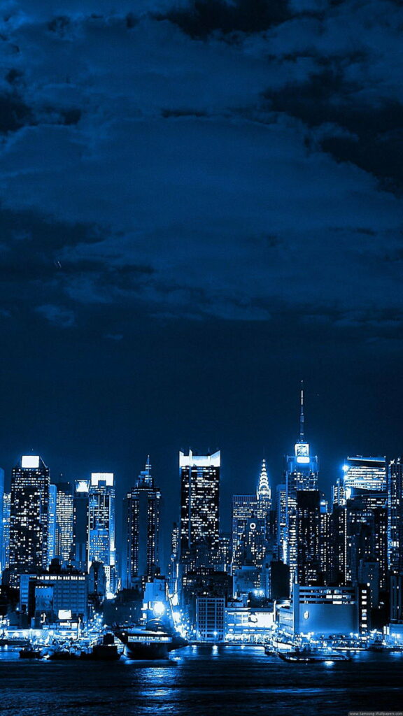 Enchanting Midnight Symphony: A Captivating Cityscape Illuminated under the Stars - Breathtaking HD Phone Wallpaper