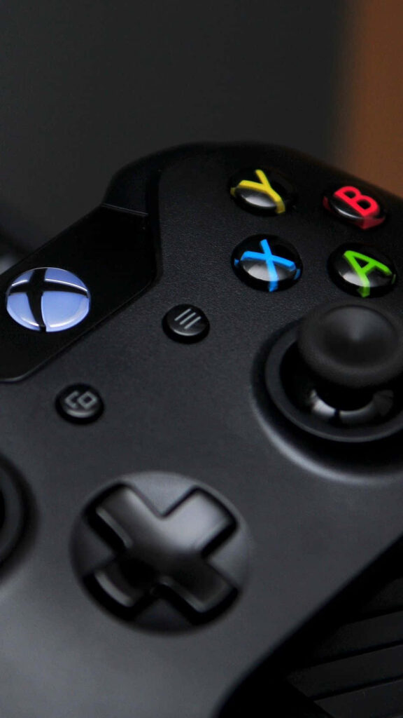 Close-Up of a Sleek Xbox Controller amid Stunning Background Image Wallpaper
