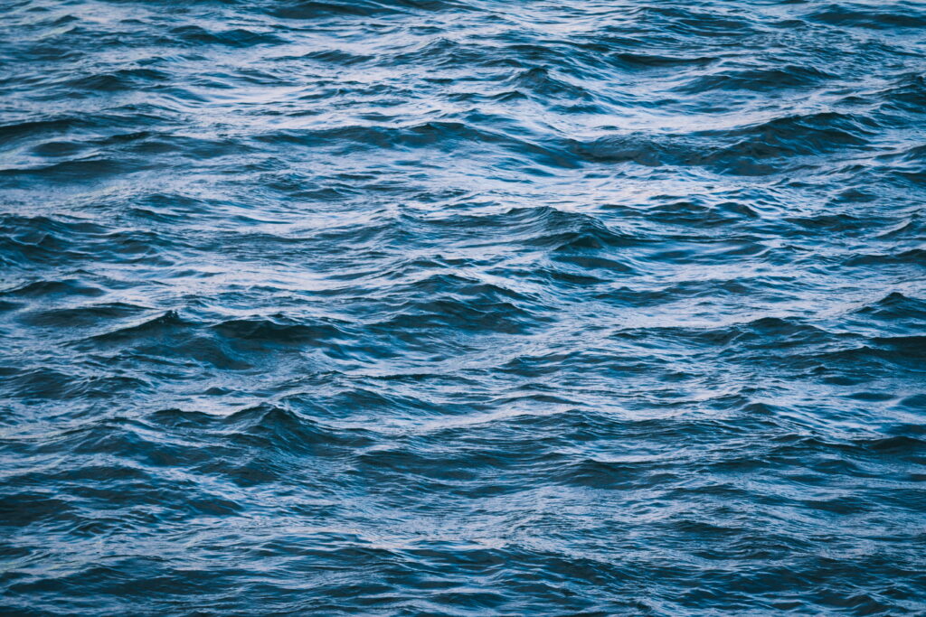 Aquatic Symphony: Mesmerizing 5K Wallpaper of Majestic Ocean Waves and Serene Ripples