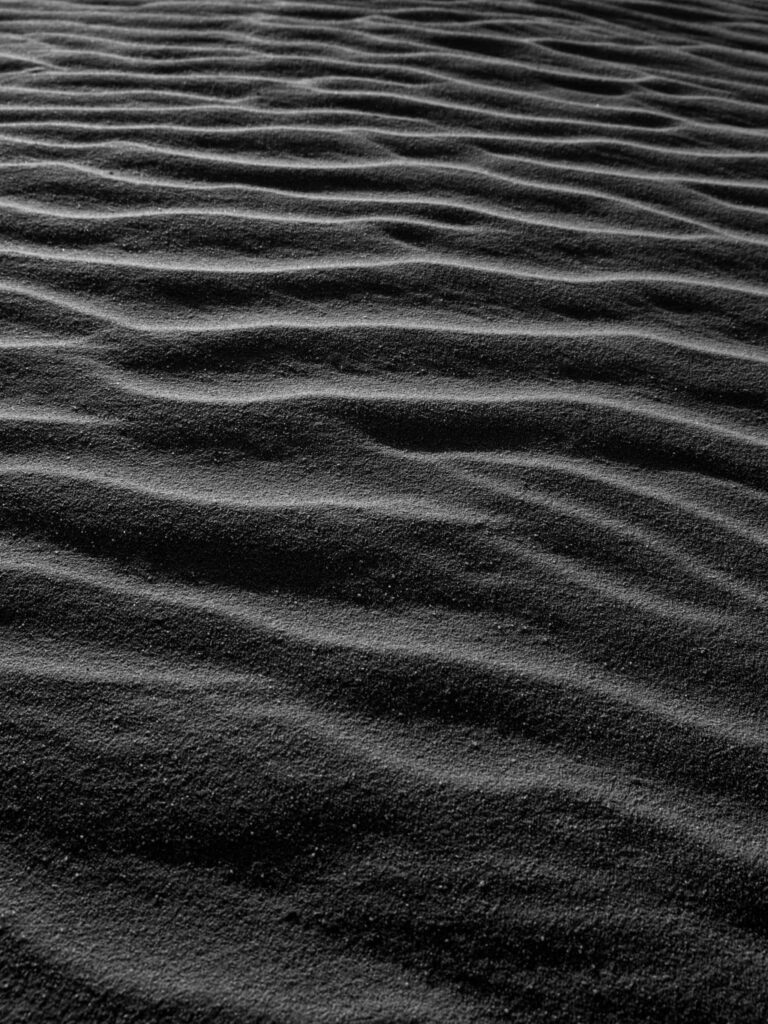 Mystical Dark Sand Desert Wallpaper with Serene Textures & Ripples
