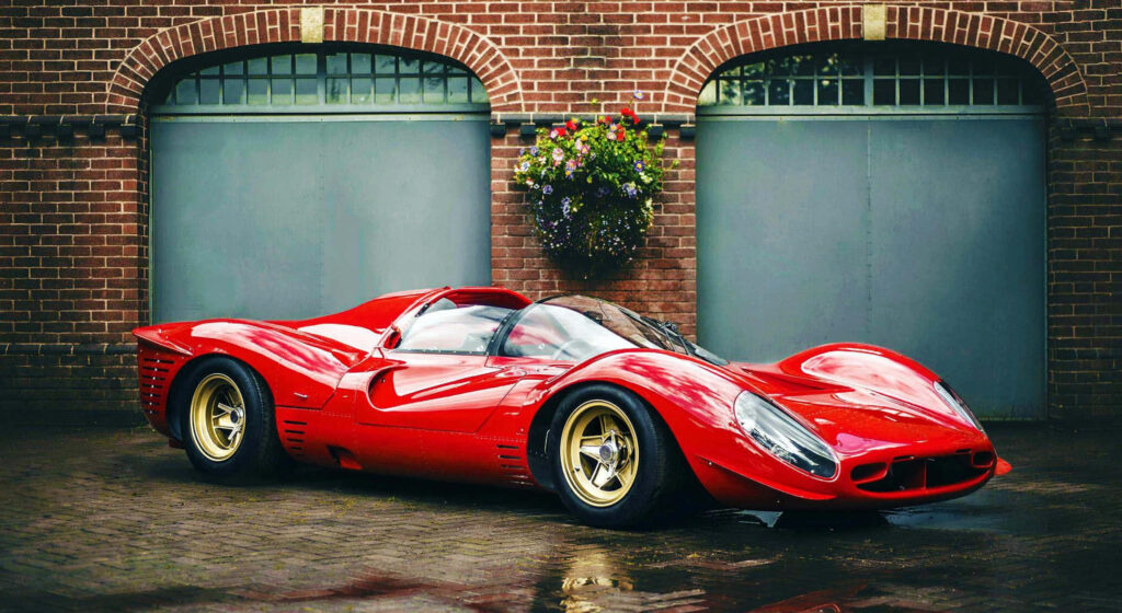 The Exquisite Beauty of a Red Ferrari 330 P4: A Captivating Wallpaper With Luxurious Gold-Plated Rims