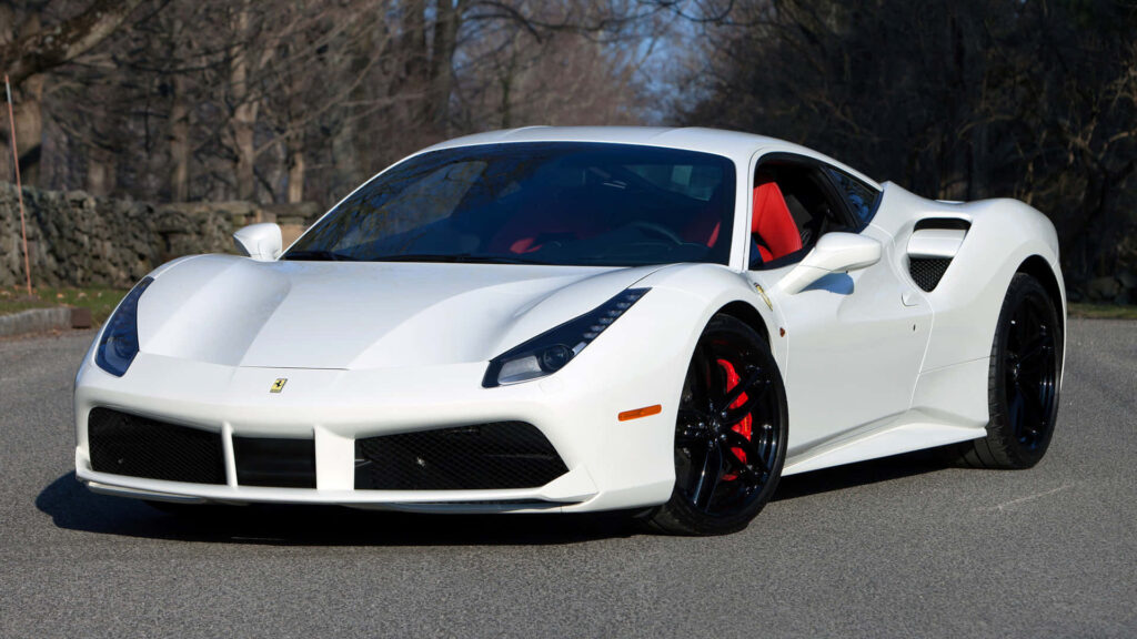 Unleashing the Power: The Allure of the Red Ferrari 488 Spider on an Open Road amidst Breathtaking Scenery Wallpaper