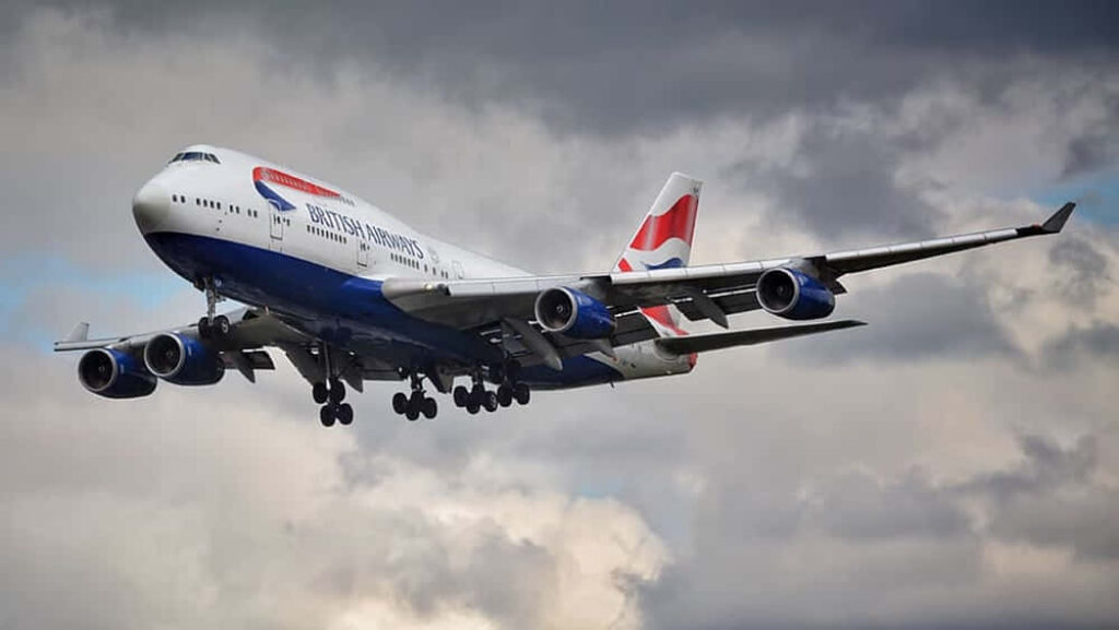 Majestic Jumbo Jet Soaring Through Ethereal Clouds: Awe-Inspiring Vision of Sky-High Magnificence Wallpaper