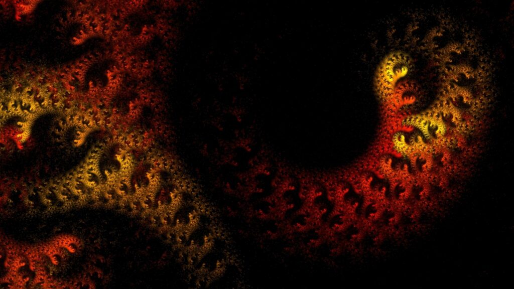 Captivating Fractal Pattern Wallpaper in Warm Hues Against Black