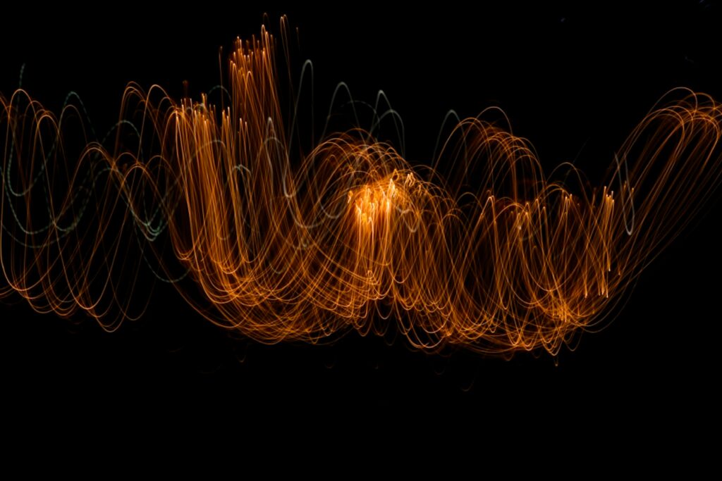 Glowing Wavy Lines: Captivating Freezelight Wallpaper Background