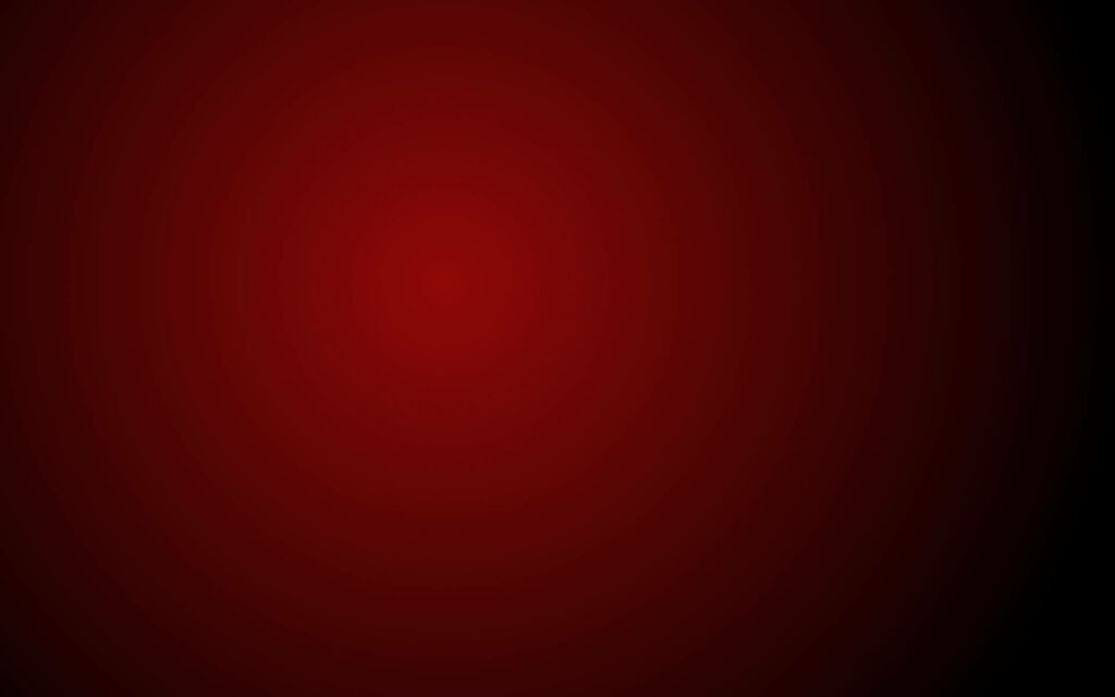 Fiery Shadows: A Daring Gradient of Dark Red Embraces a Plain Black Canvas Wallpaper