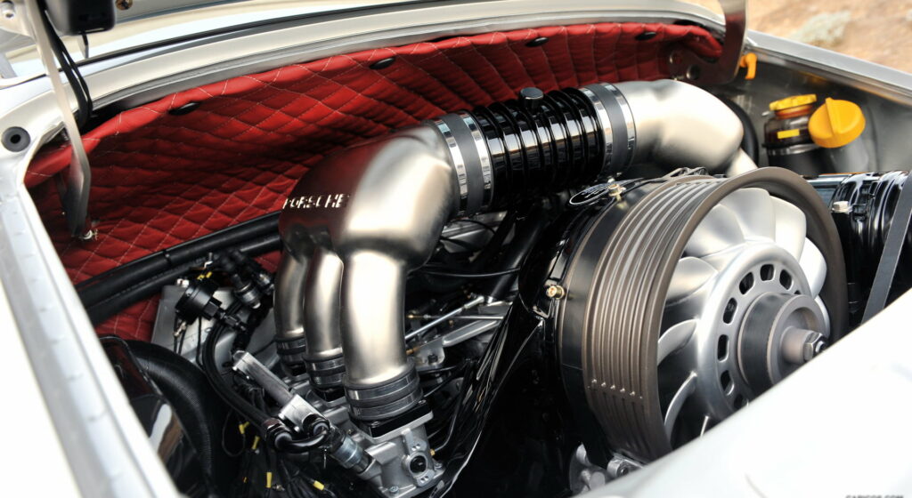 Revving Perfection: Captivating High-Definition Wallpaper of the Sensational Singer Porsche 911 Silver Engine at Full Throttle