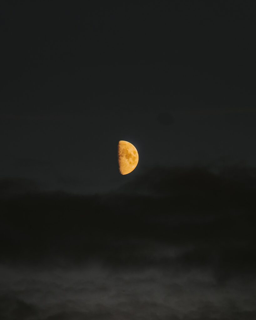Glowing Half-Moon Wallpaper: Mysterious Night Sky Background