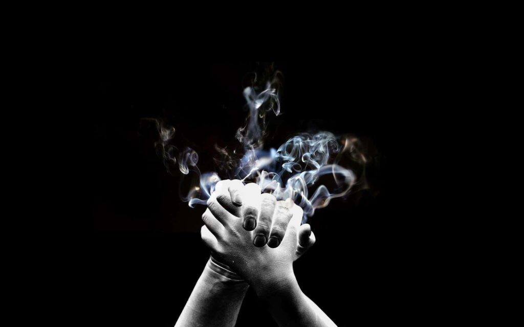 Captivating Hands Clasped Wallpaper with Ethereal Smoke Effect