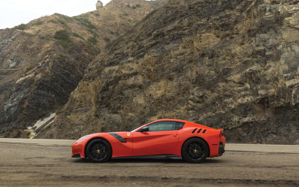 Exquisite Ferrari F12 Berlinetta: A Fusion of Luxury and Velocity Unleashed on the Road Wallpaper