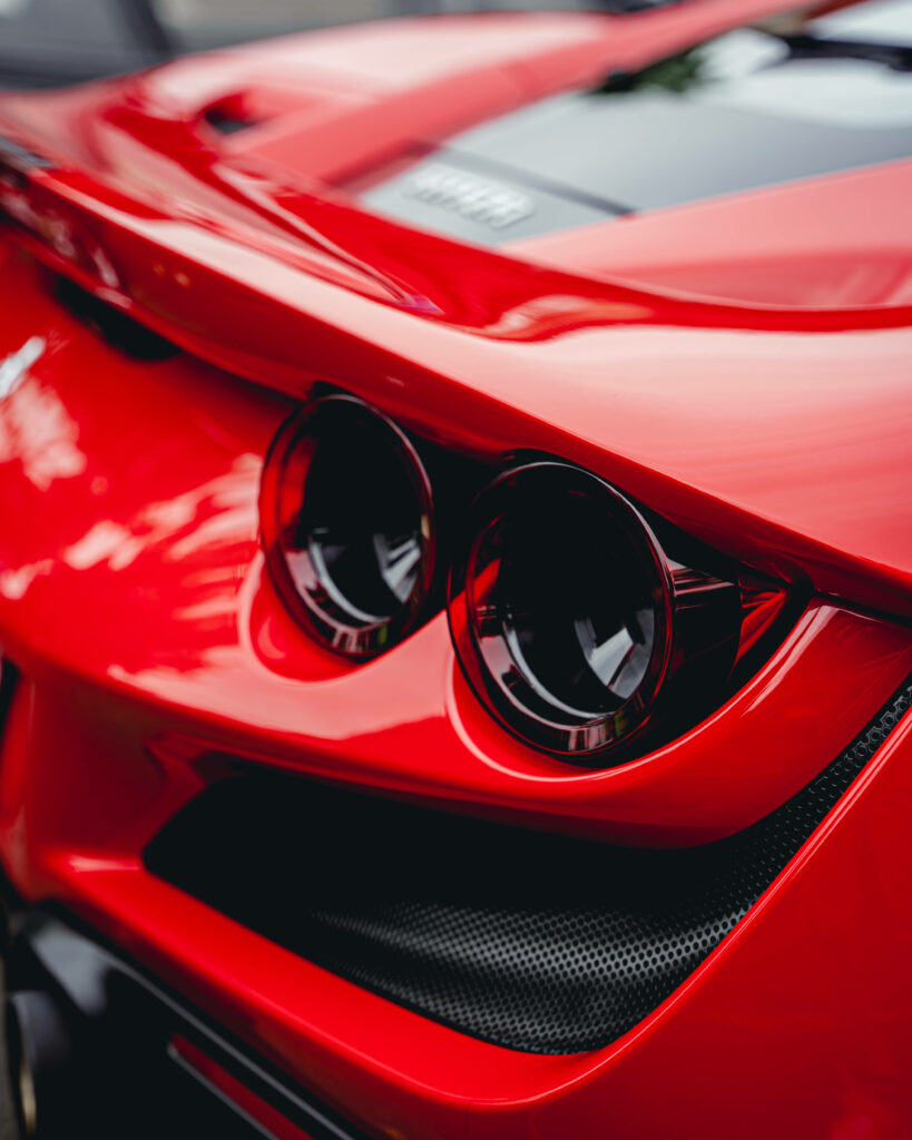 Spectacular Macro Shot of Dark Red Ferrari F8 Tributo's Captivating Rear Lights - Mesmerizing 4k Ferrari Background Image Wallpaper