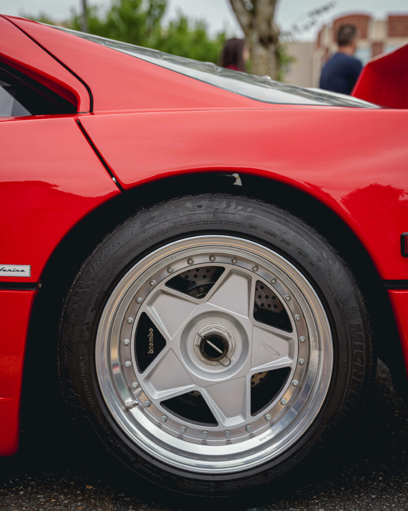 Intriguing Macro Capture: Stunning Ferrari F40 in Vibrant Red Showcasing Star Rimmed Wheels Wallpaper