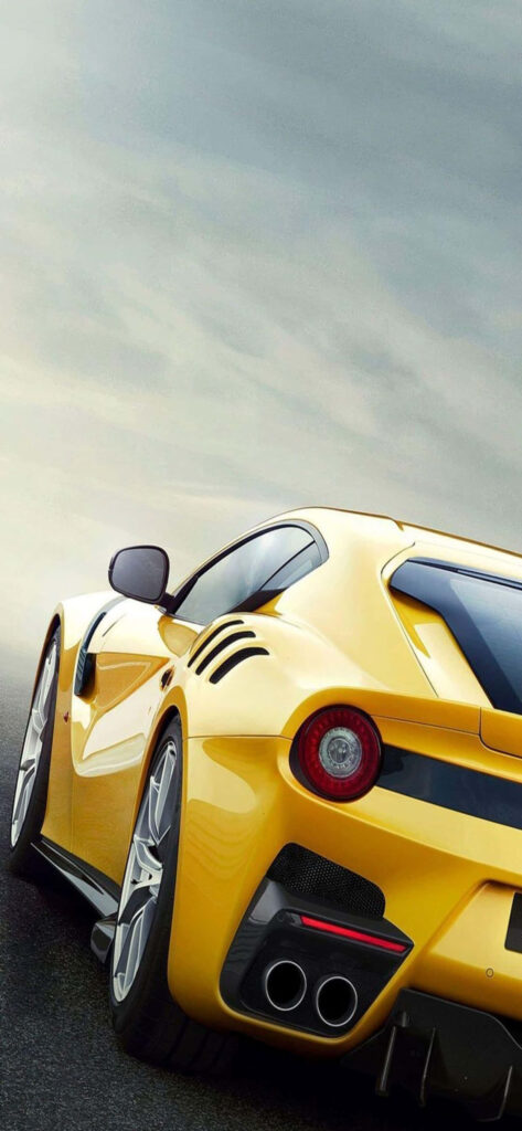 Captivating Snapshot: Beautifully Set Max Ferrari Background Highlighting a Vibrant Yellow Ferrari F12tdf Wallpaper