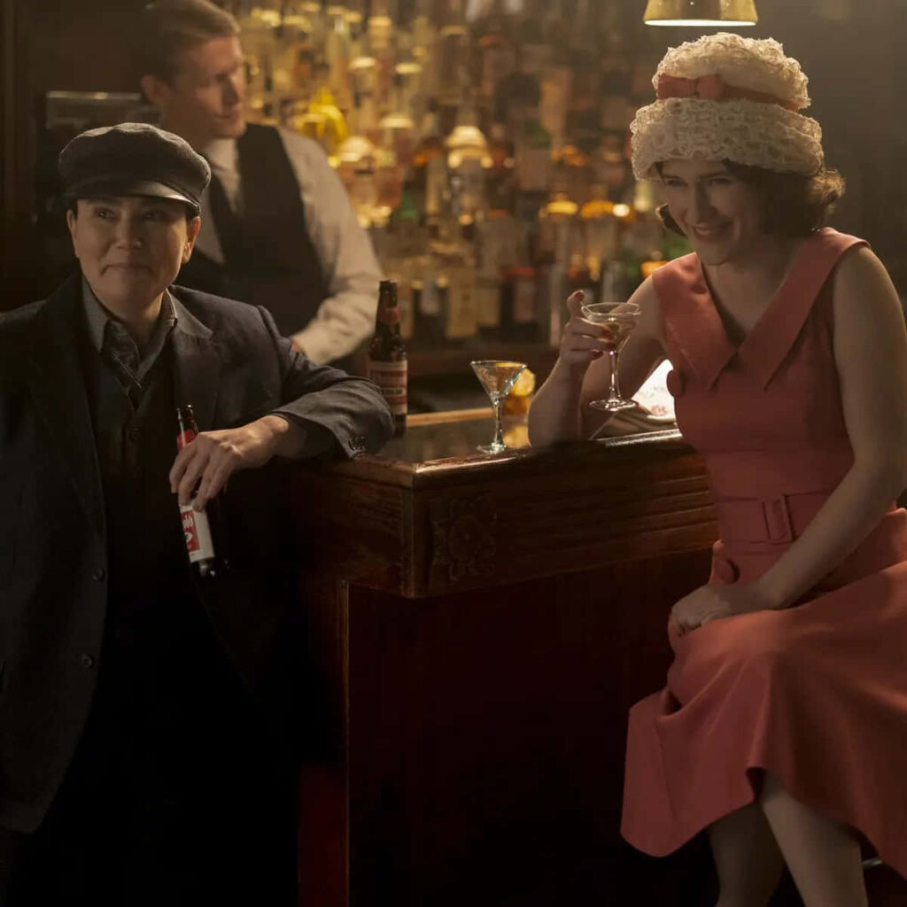 Vibrant Midge Maisel Wallpaper: Stand-Up Comedy Charm & Humor