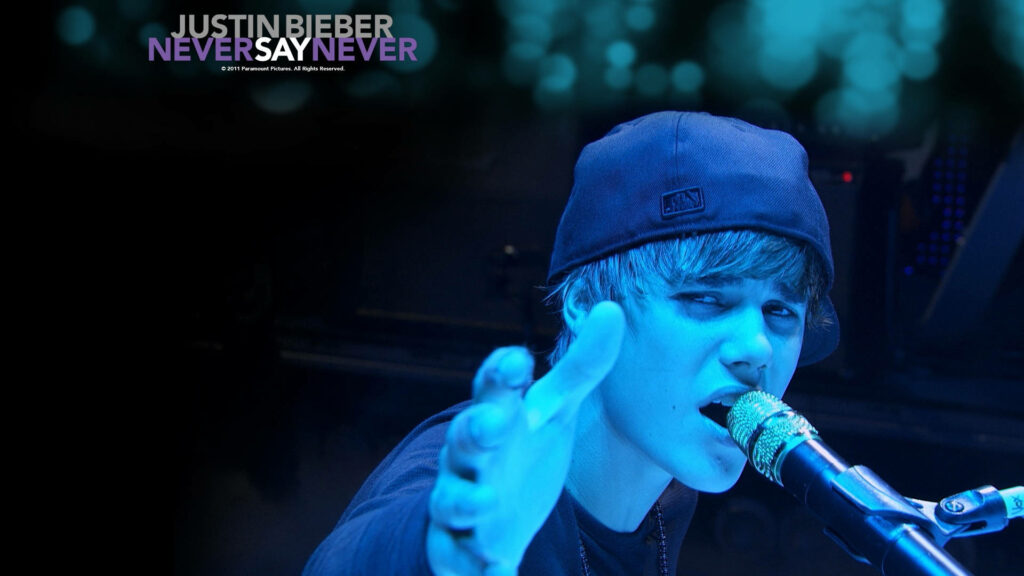 Justin Bieber's Electrifying Performance: Captivating the Crowd in Stylish Attire Wallpaper