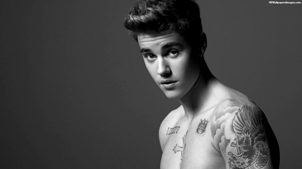 Captivating Monochrome: Sizzling Justin Bieber Strikes a Pose in Sultry Jumpsuit Wallpaper