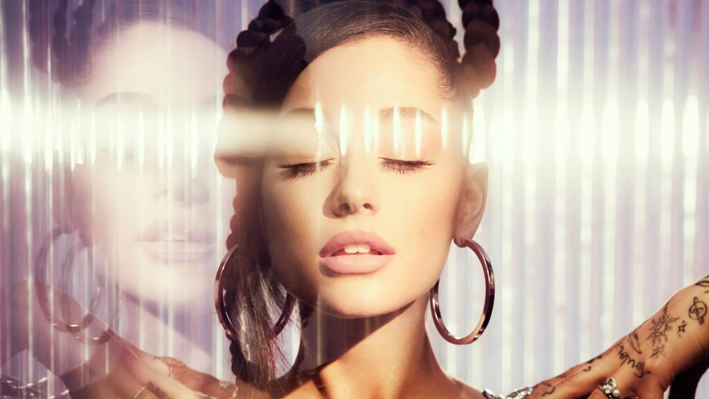 Ariana Grande: Sultry Melody of Stars - A Captivating Allure with Musical Brilliance Wallpaper