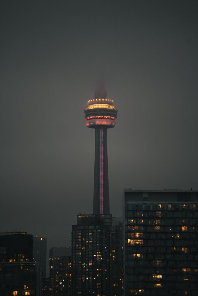 Stunning Nighttime Cityscape Wallpaper: Towering Structure & Fog