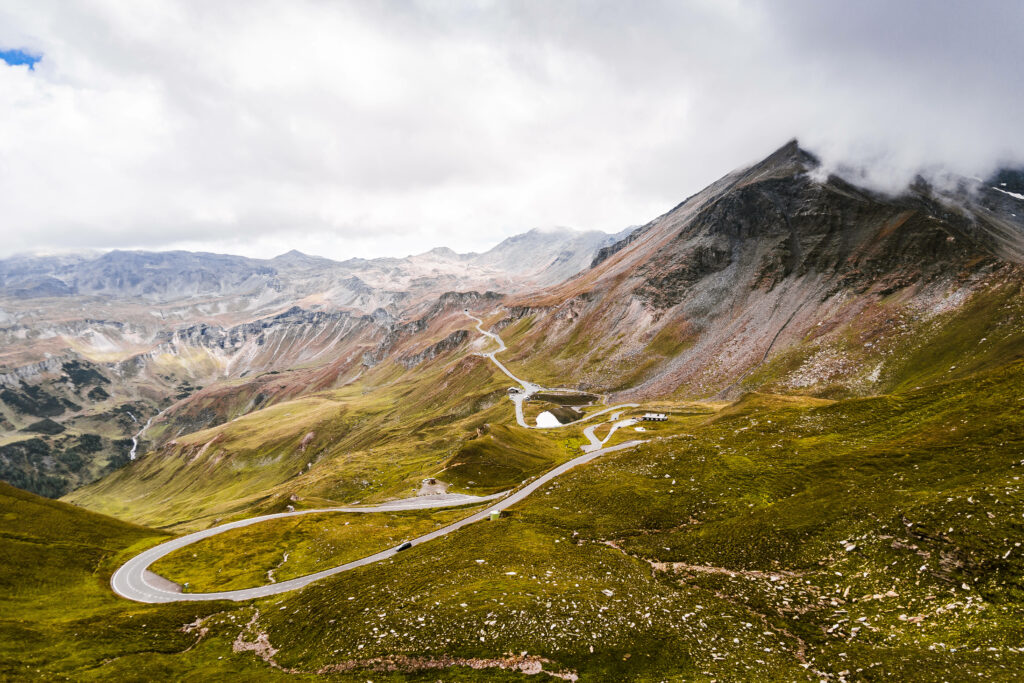 Immersive Panorama: Capturing the Majestic Grossglockner Mountain Pass Road in Austria Wallpaper