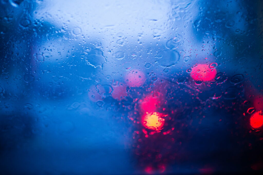 Dancing Raindrops: A Captivating Macro Blur in High Definition Wallpaper