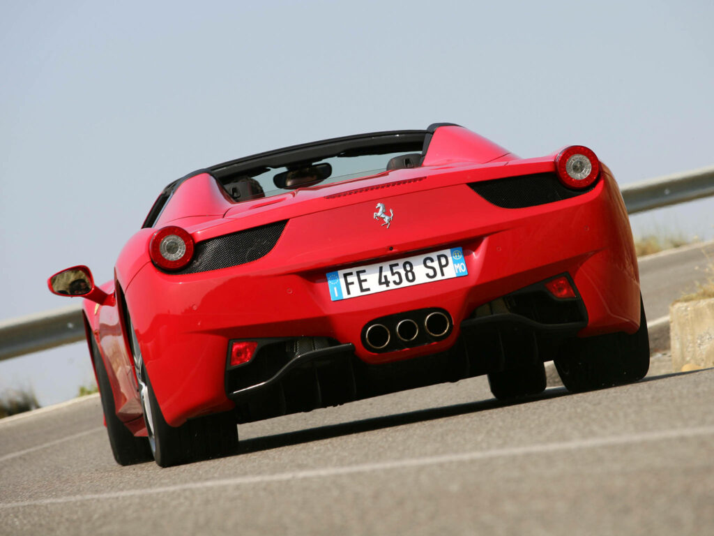 Stunning Rear Shot of Vibrant Red 4K Ferrari Italia 2010: A Captivating Automotive Masterpiece Wallpaper