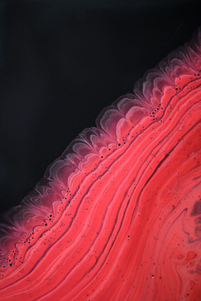 Stunning Macro Wallpaper of Vibrant Red Acrylic Paint Patterns