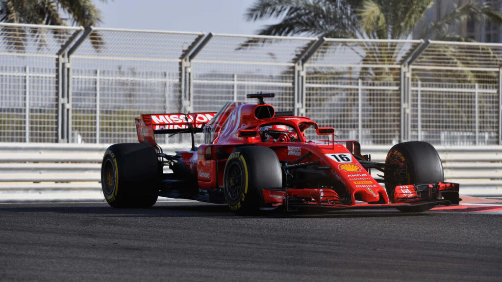 Captivating Landscape: Vibrant Red Scuderia Ferrari Formula One on Racetrack - Perfect F1 2019 Wall Background Wallpaper