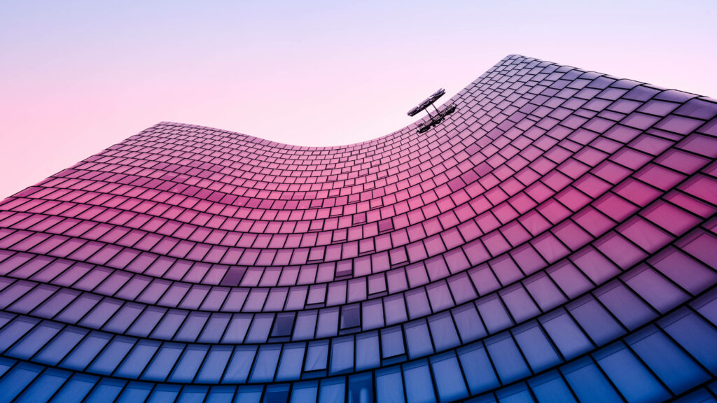 Enchanting Sunrise Reflections on a Majestic Pink Building - Captured in 4D Ultra HD for Mesmerizing Background Display Wallpaper