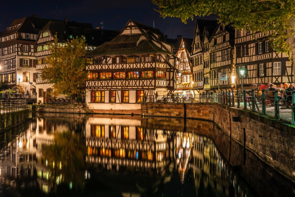 Majestic Reflections: Captivating Urban Scenery of Strasbourg's Canal-Front Buildings in France Wallpaper