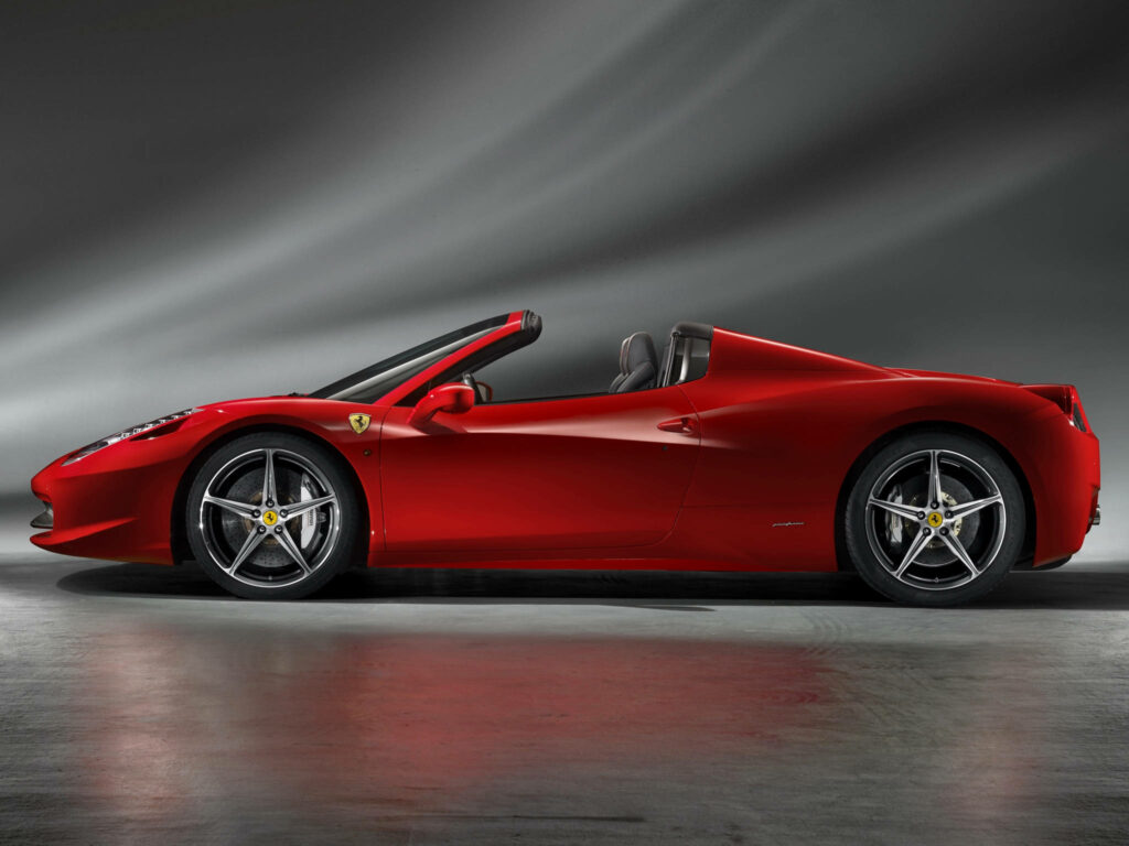 Captivating 4K Ferrari 2012 Spider: A Striking Red Jewel Amidst Abstract Gray Canvas Wallpaper