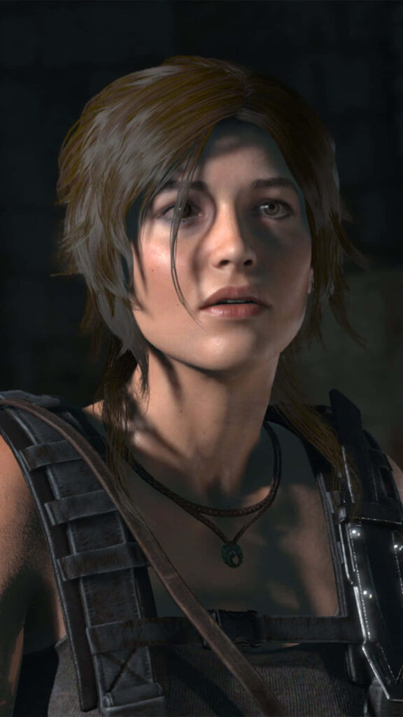 Close-up of Lara Croft from Rise of the Tomb Raider with realistic graphics and determined expression Wallpaper