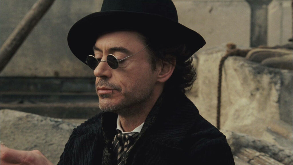 Sherlock Holmes Contemplative Wallpaper: Moody Pier Scene