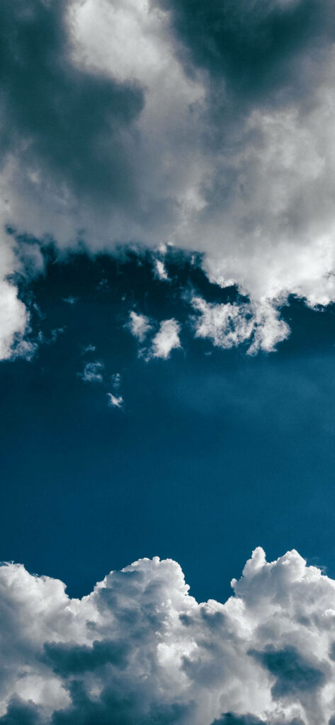 Skyward Dreams: Captivating Fluffy Clouds for Your Iphone Amoled Background Wallpaper