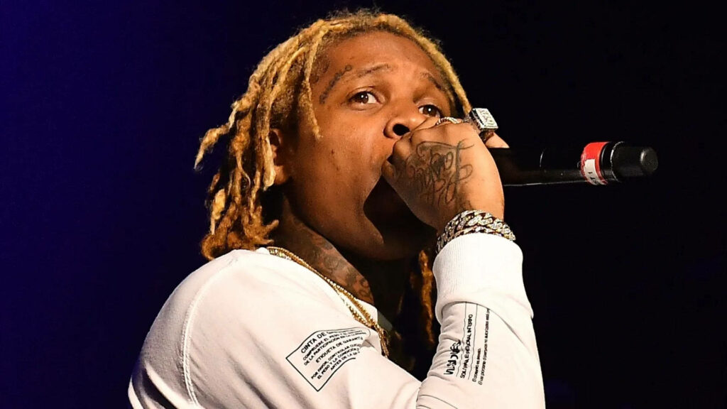 Lil Durk Dominating the Stage with Intense Mic Skills Wallpaper