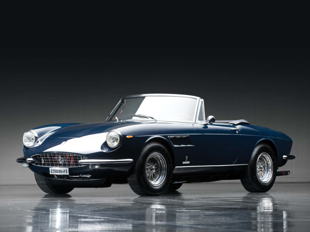 Captivating Snapshot: Shadows Envelop a Stylish Studio Shot of a Dark Blue Ferrari 330 GTS Convertible Wallpaper
