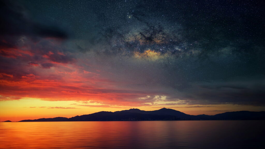 Starry Skies Ignite as Sun Bids Farewell: A Captivating HD Wallpaper of Scenic Sunset