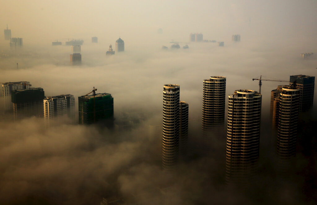 Modern Urban Skyline Wallpaper: High-Rise Buildings in Hazy Smog