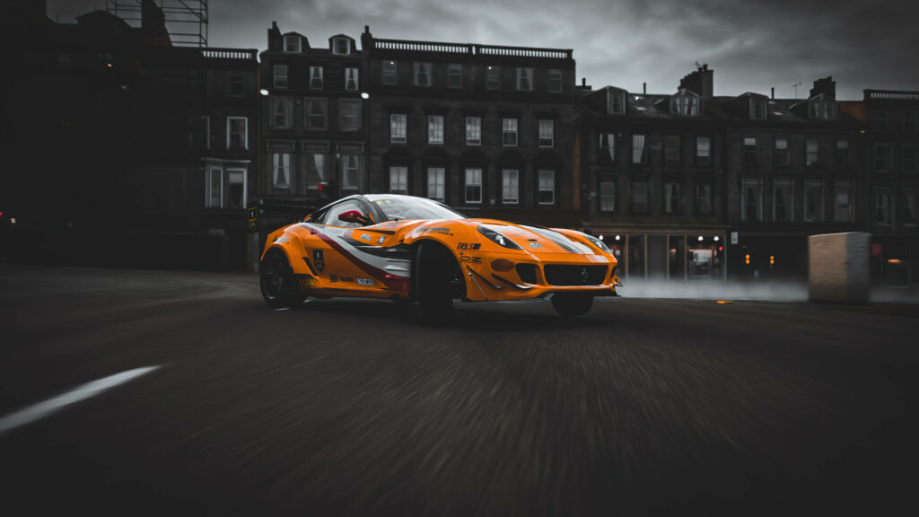 Vivid City Drift: Exhilarating Yellow Ferrari 599 Glides Through Forza 4's Urban Landscape Wallpaper