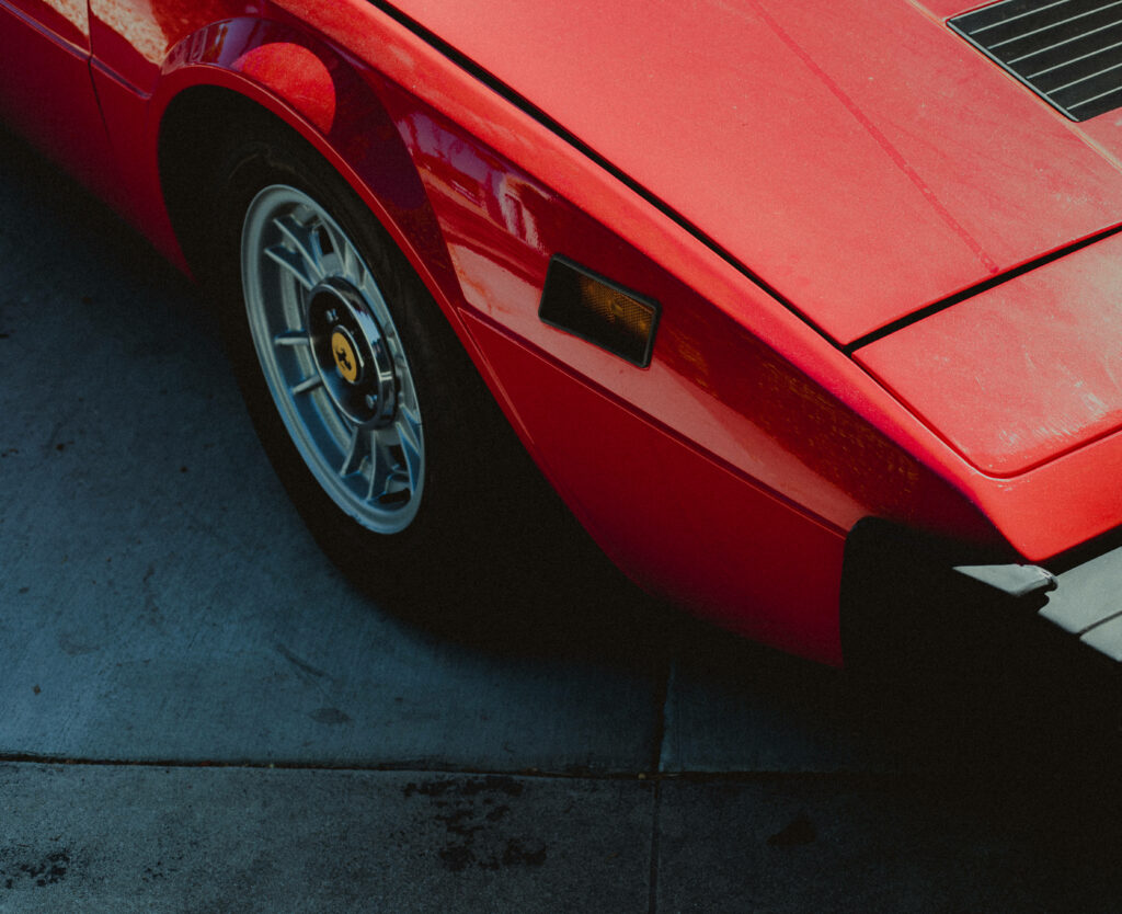 Sleek and Elegant: A Spotlight on the Iconic Red Ferrari's Rear Wheel Wallpaper