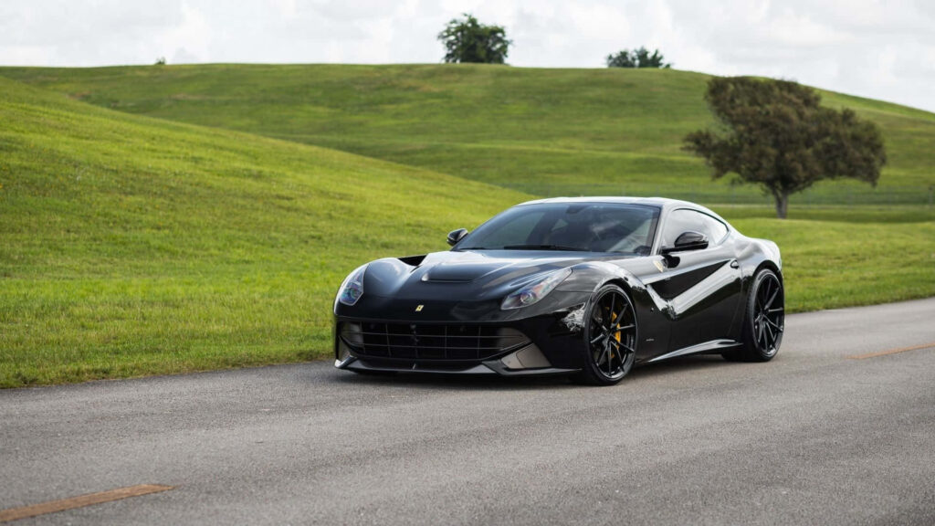 Cruising with Italian Excellence: Capturing the Breathtaking Design and Performance of a Red Ferrari F12 Berlinetta in High-Resolution Wallpaper