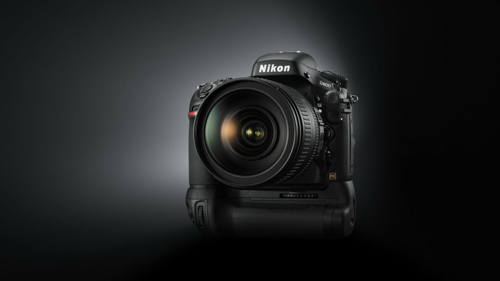 Capturing Perfection: A Stunning HD Wallpaper Featuring the Black Nikon D800 DSLR Camera and its Lens