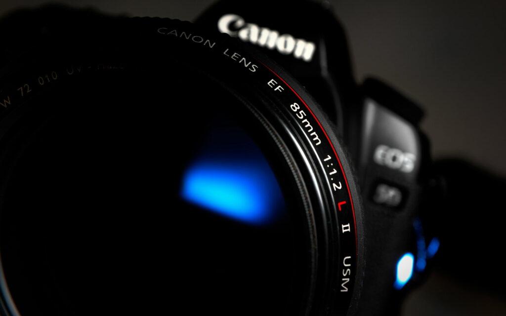 In Focus: Capturing Life's Moments with a Sleek Black Canon EOS DSLR Camera Wallpaper
