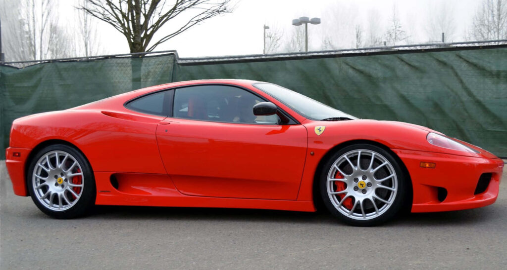 Dynamic Elegance: Immersive Wallpaper Showcasing the Striking Ferrari 360 Modena in Motion