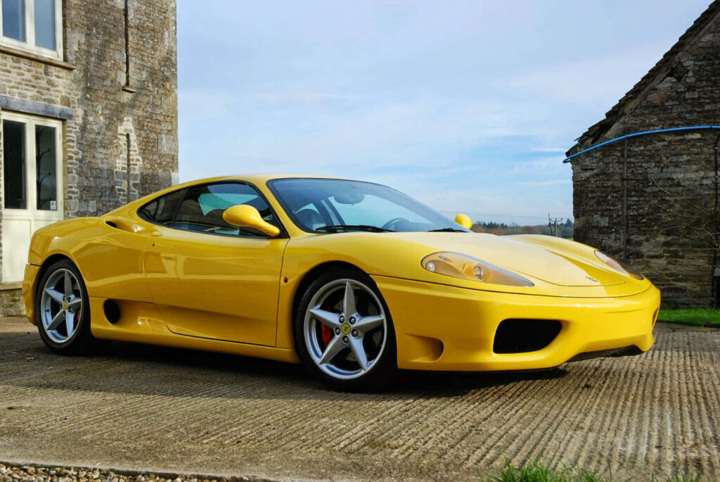Yellow Ferrari 360 Modena Near Old House Background Wallpaper
