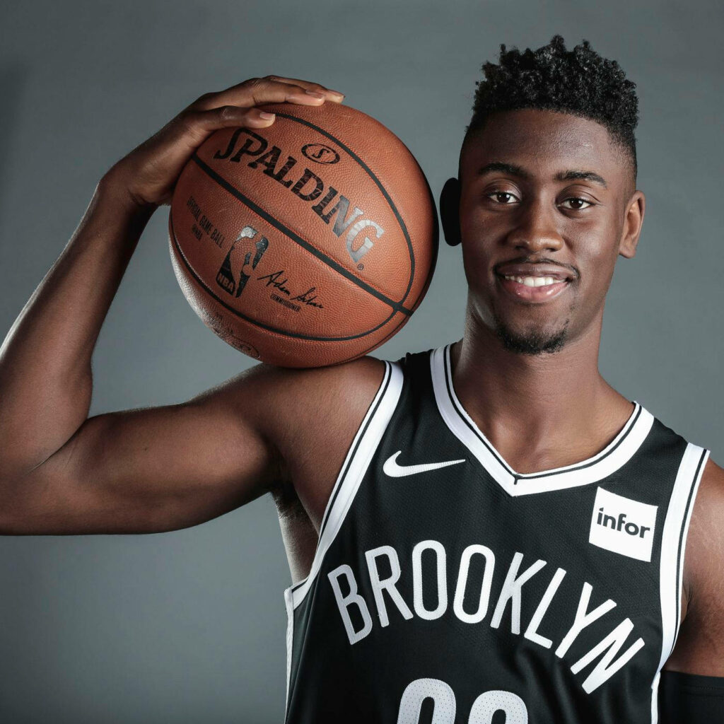 Caris LeVert Brooklyn Nets portrait holding Spalding basketball sharp focus wallpaper background