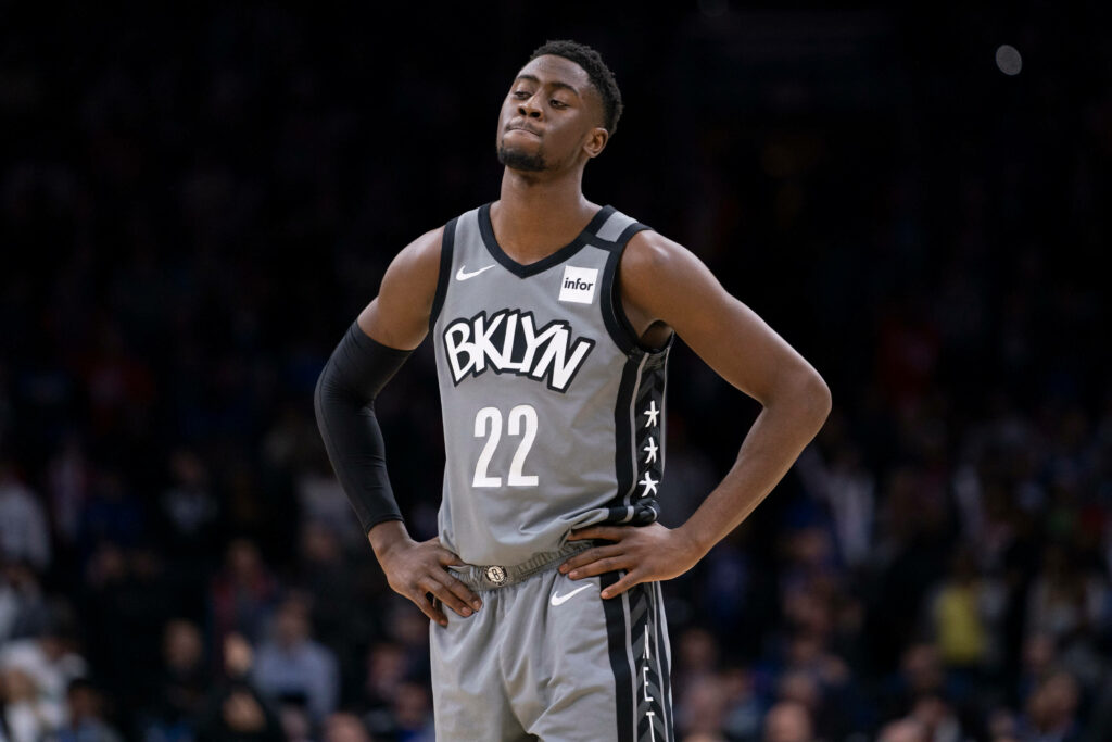 Caris LeVert in Brooklyn Nets grey jersey number 22 focused on court high definition sports photo Wallpaper