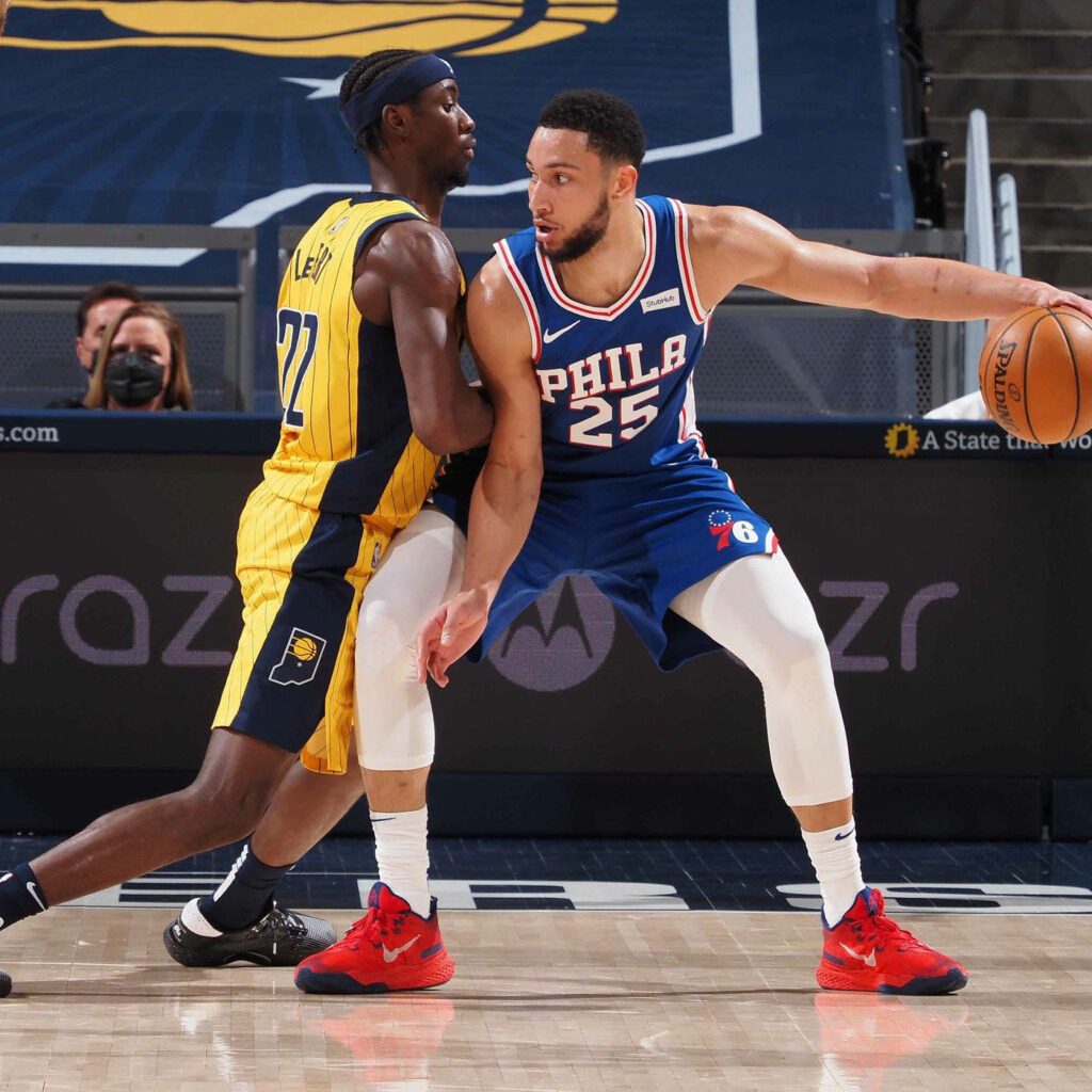 Caris LeVert defends Ben Simmons in Indiana Pacers vs Philadelphia 76ers intense NBA game action Wallpaper