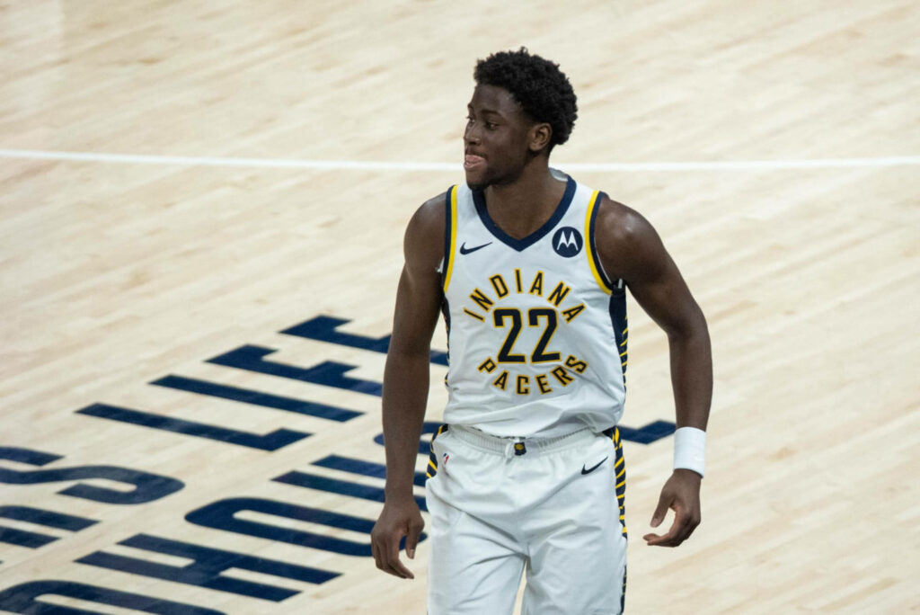 Caris LeVert Indiana Pacers in white navy jersey on court mid game focused dynamic action shot Wallpaper