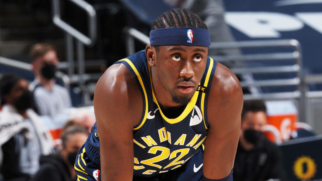 Caris LeVert Indiana Pacers focused in navy blue gold uniform intense NBA game basketball wallpaper