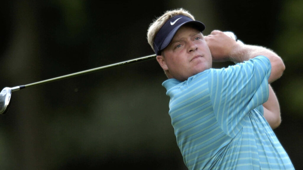 Carl Pettersson mid golf swing intense focus vibrant green golf course tournament energy wallpaper